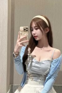 Young woman taking a selfie.