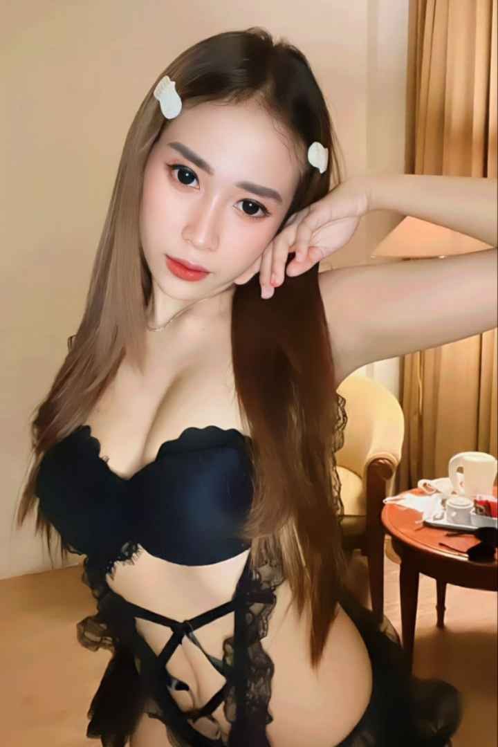 Attractive young woman in black lingerie.