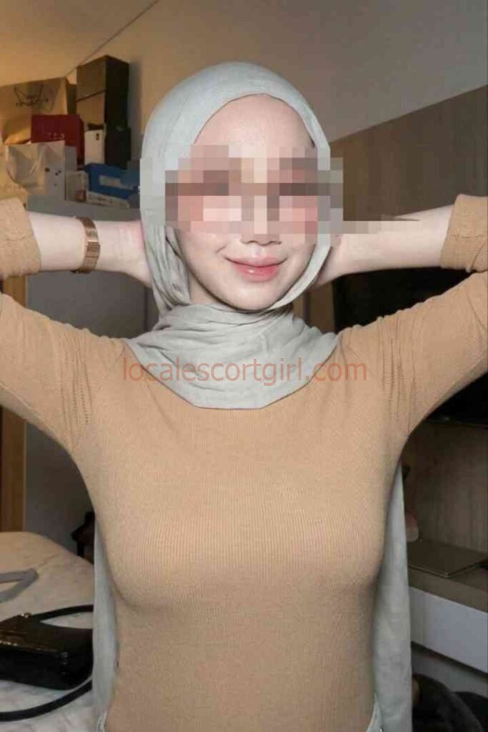 Young Malay woman in hijab, styled for incall sessions